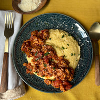Italian Sausage Tempeh Bowl A simple yet delicious Mediterranean inspired dish of creamy, cheesy bowl of polenta topped with a robust, meaty ragu makes a healthy comfort dish full of sunny Italian flavors.