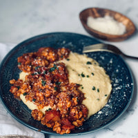 Italian Sausage Tempeh Bowl A simple yet delicious Mediterranean inspired dish of creamy, cheesy bowl of polenta topped with a robust, meaty ragu makes a healthy comfort dish full of sunny Italian flavors.